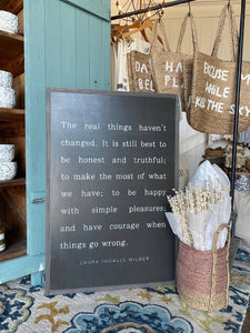 The Real Things Haven't Changed STANDARD FONT: 24"X36" / Black sign/white lettering